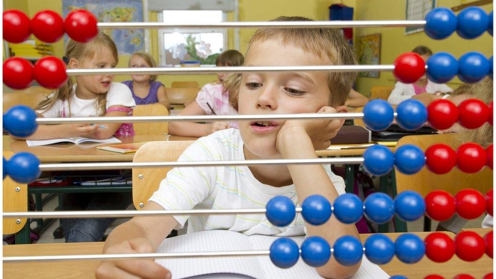 Child using abacus