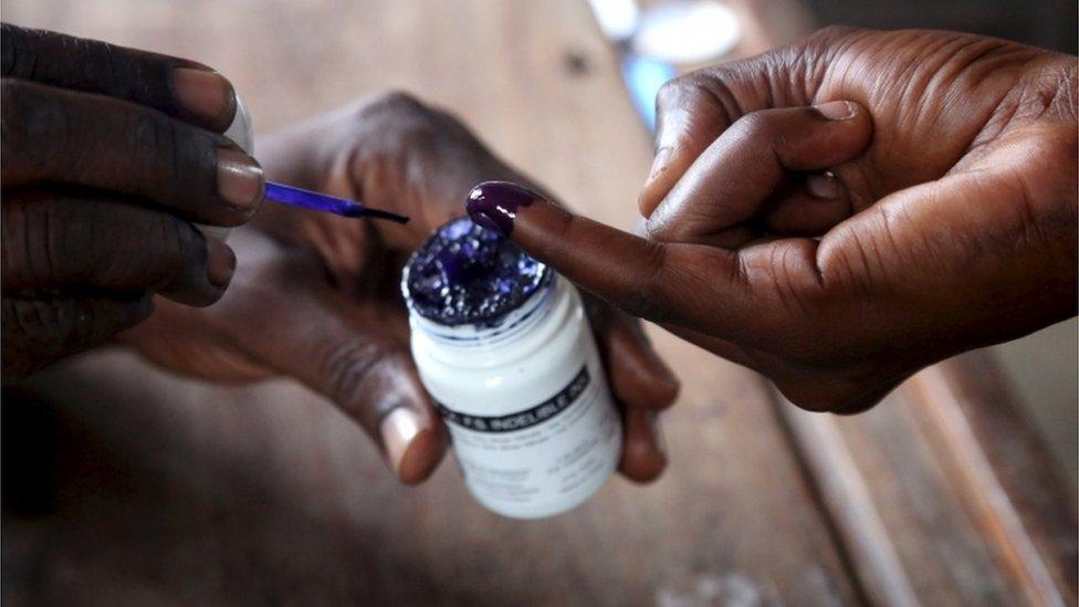 A woman has her finger inked after casting her ballot at a polling station during the presidential and parliamentary election in Ubungo ward in the Kinondoni district of Dar es Salaam, October 25, 2015