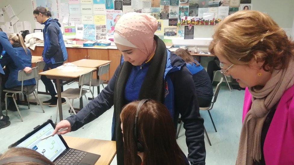 Language teacher and Syrian students