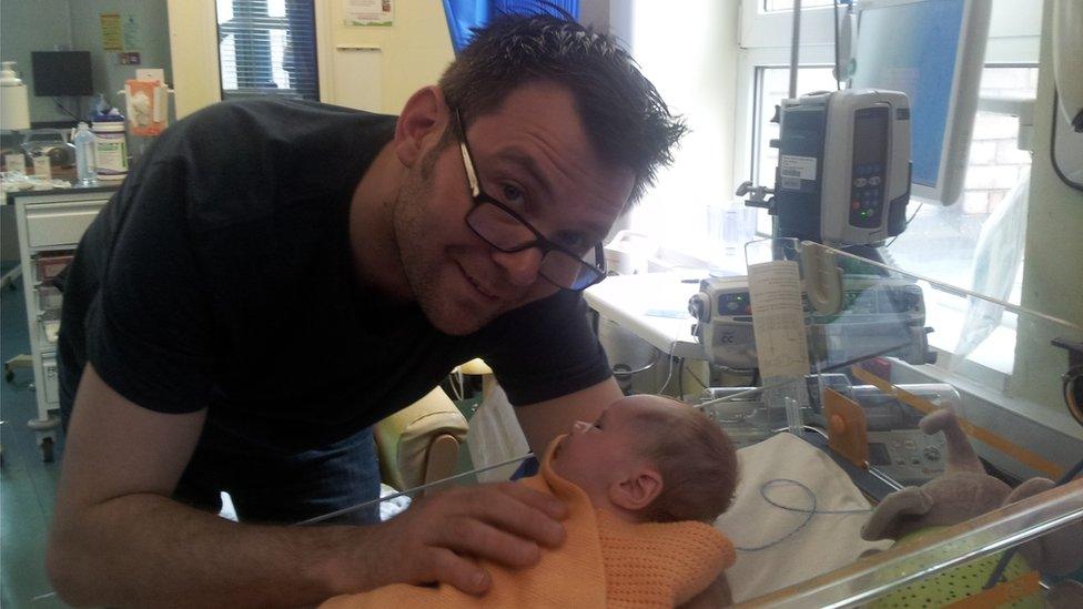 Ben Ryan with new born Sol in hospital