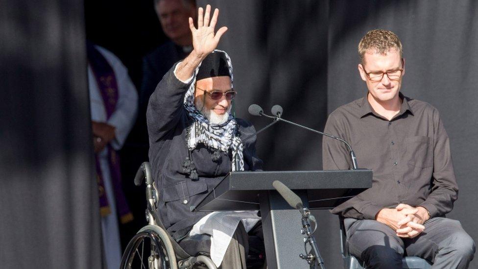 Farid Ahmed, a survicor of the Christchurch shooting, waving to the crowd at the remembrance service on March 29