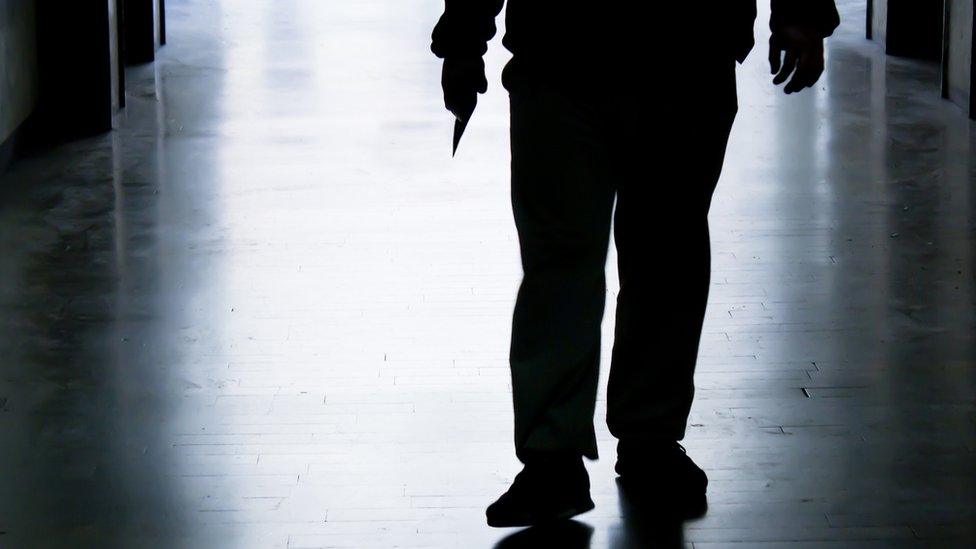 Stock image of a person with a knife