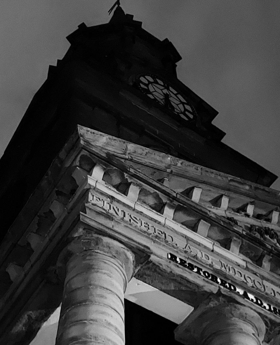 A black and white picture of a building