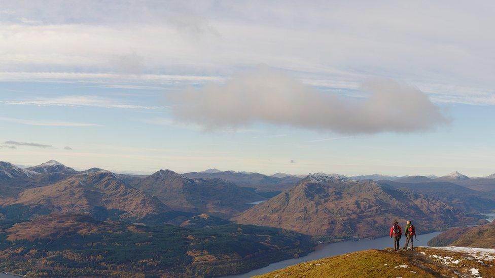 A couple pause for a rest on Ben Lomond