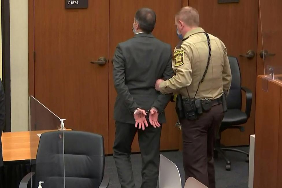 Former Minneapolis police officer Derek Chauvin is led away in handcuffs after a jury found him guilty of all charges in his trial for second-degree murder, third-degree murder and second-degree manslaughter in the death of George Floyd in Minneapolis, Minnesota, 20 April 2021