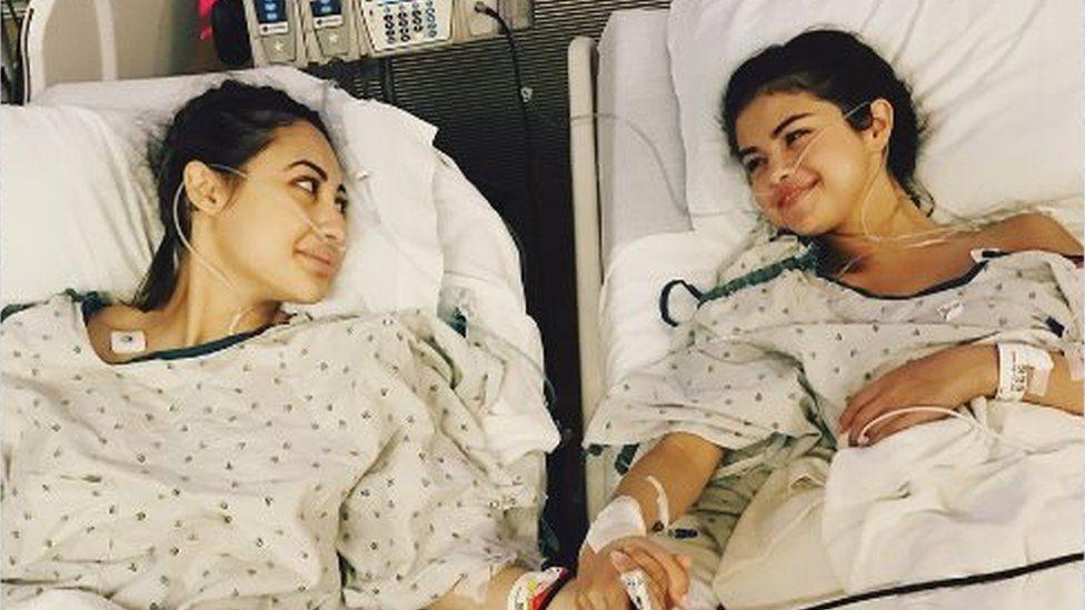 Selena Gomez pictured in her hospital bed alongside friend Francia Raisa.