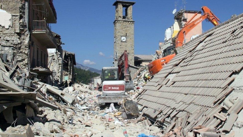 Destroyed buildings and rubble near the bell-tower in Amatrice