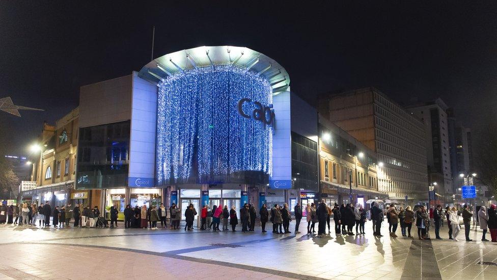 Shoppers queuing in Cardiff