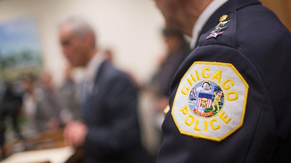 Interim Chicago Police Superintendent John Escalante listens as Mayor Rahm Emanuel speaks.