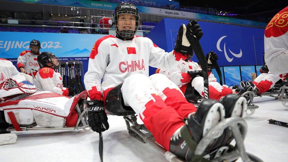 Jing Yu in ice hockey gear
