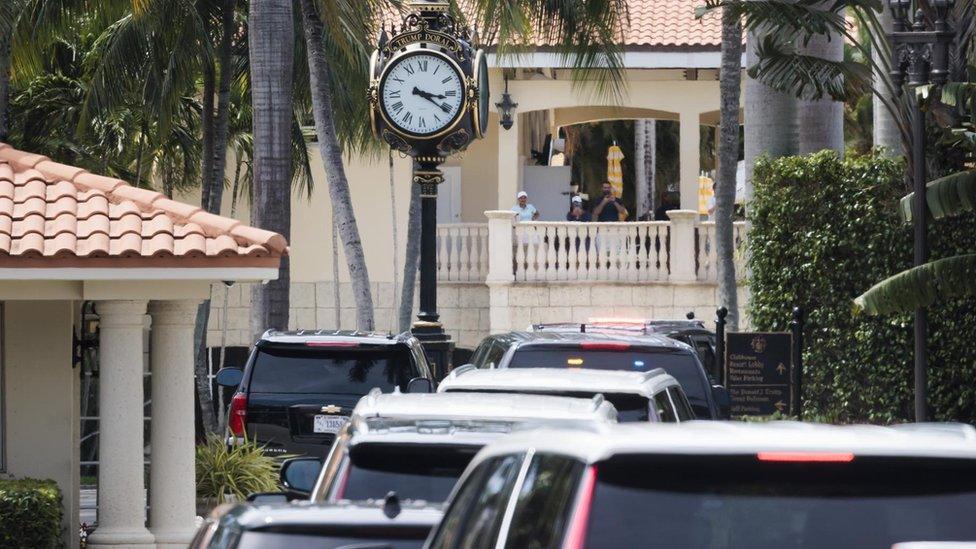 The Trump motorcade enters the Trump Doral complex on the outskirts of Miami