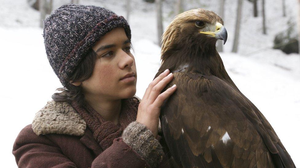 Actor Manuel Camacho with Altai the eagle on the set of Brothers of the Wind