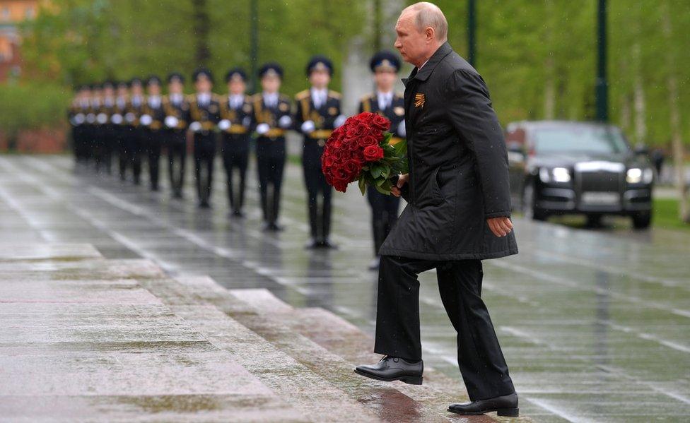 Russia's President Vladimir Putin lays flowers at the Tomb of the Unknown Soldier