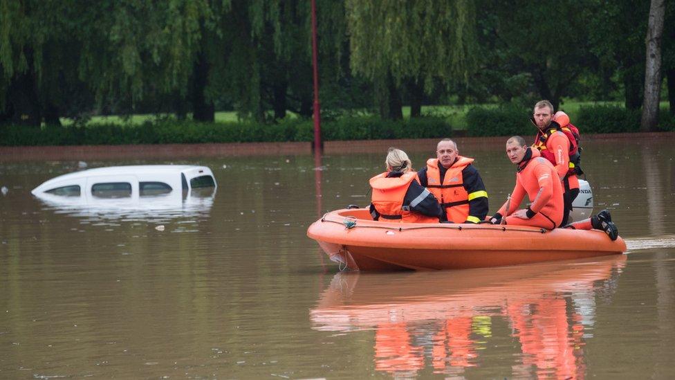 Firefighters in a dinghy in Bruay-la-Buissiere, near Lens, northern France, 31 May