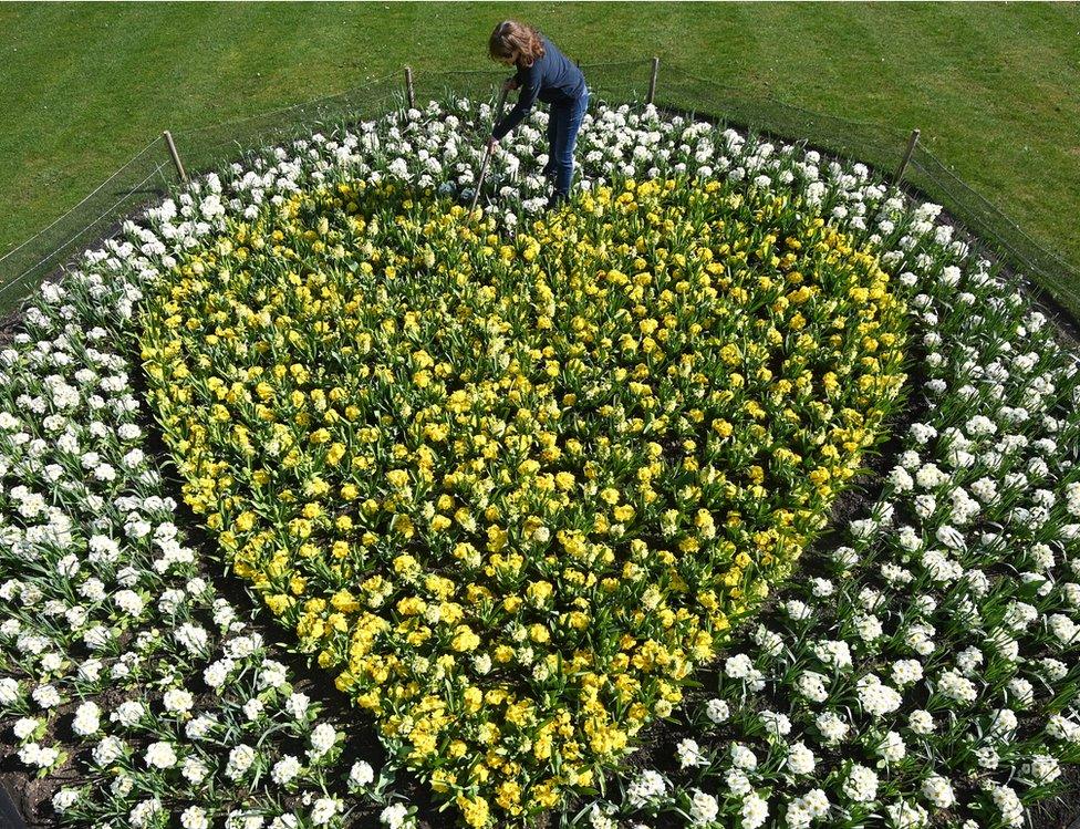 A floral tribute at Kew Gardens in south-west London remembers those lost to Covid-19