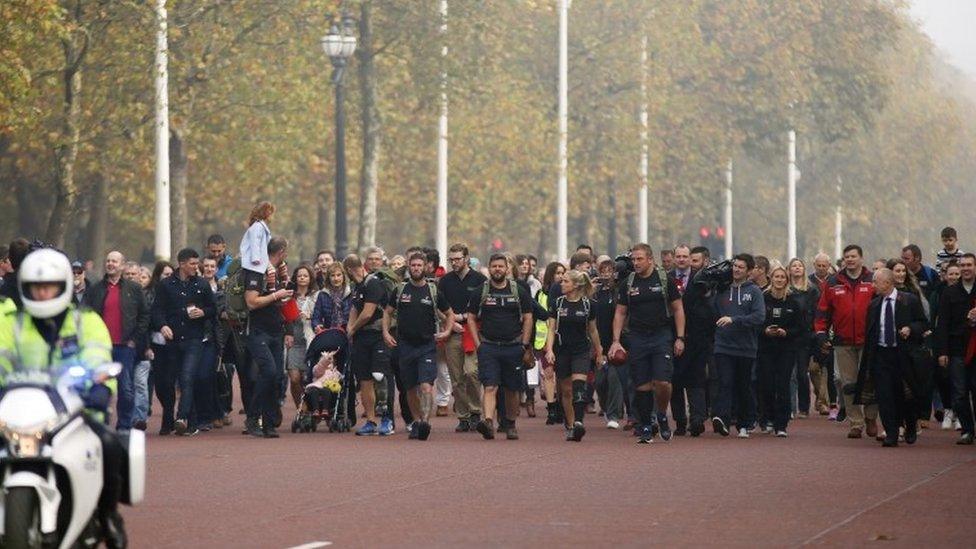 Walking With The Wounded (WWTW) Walk of Britain members walk along The Mall as they reach the finishing line at Buckingham Palace