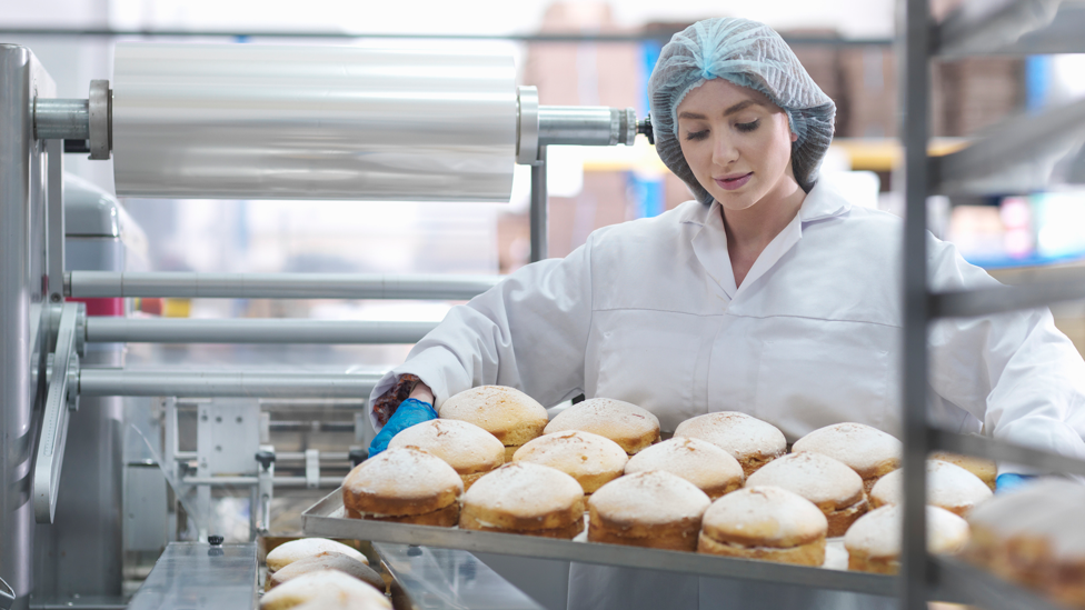 Worker in cake factory