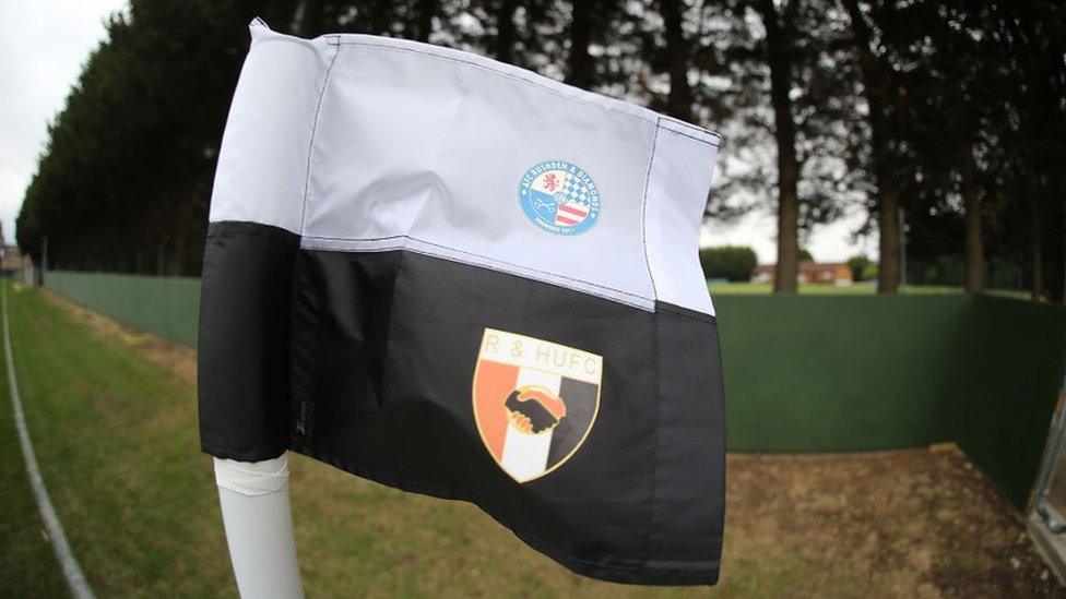 Corner flag at Hayden Road with both AFC Rushden & Diamonds and Rushden & Higham United club crests printed on it