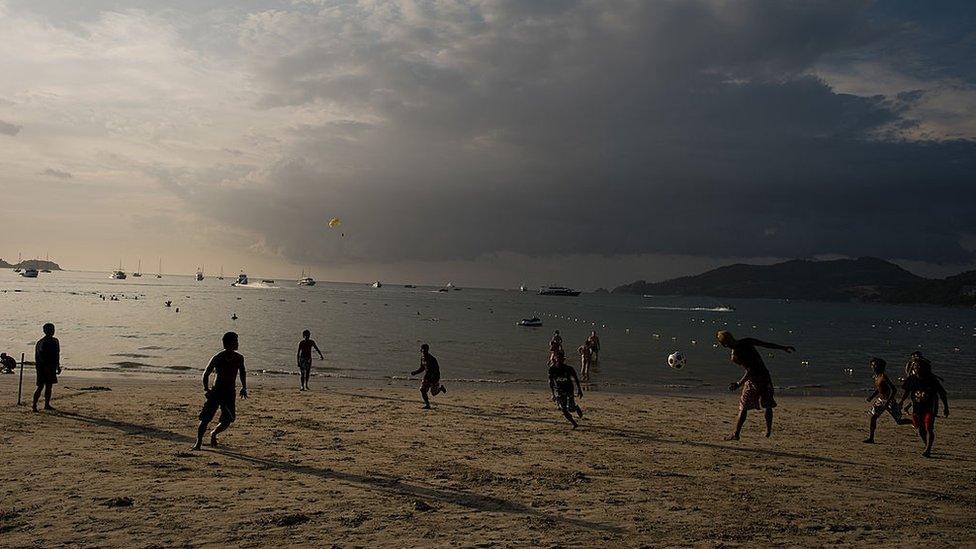 Locals playing football on Patong beach in Phuket