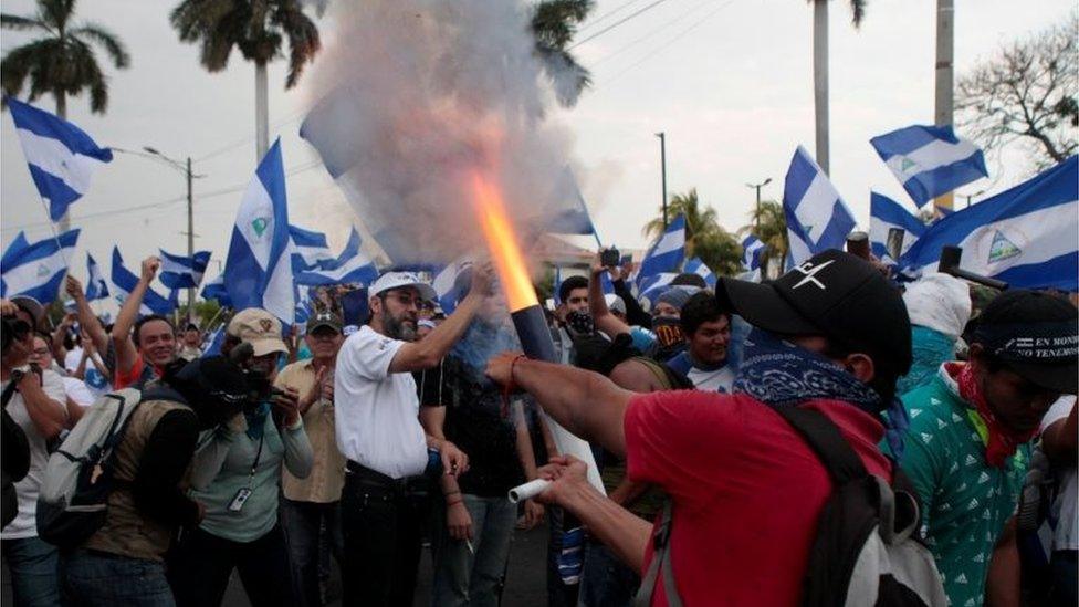 A demonstrator fires a homemade mortar during protest march against Nicaraguan President Daniel Ortega's government in Managua, Nicaragua May 9, 2018.