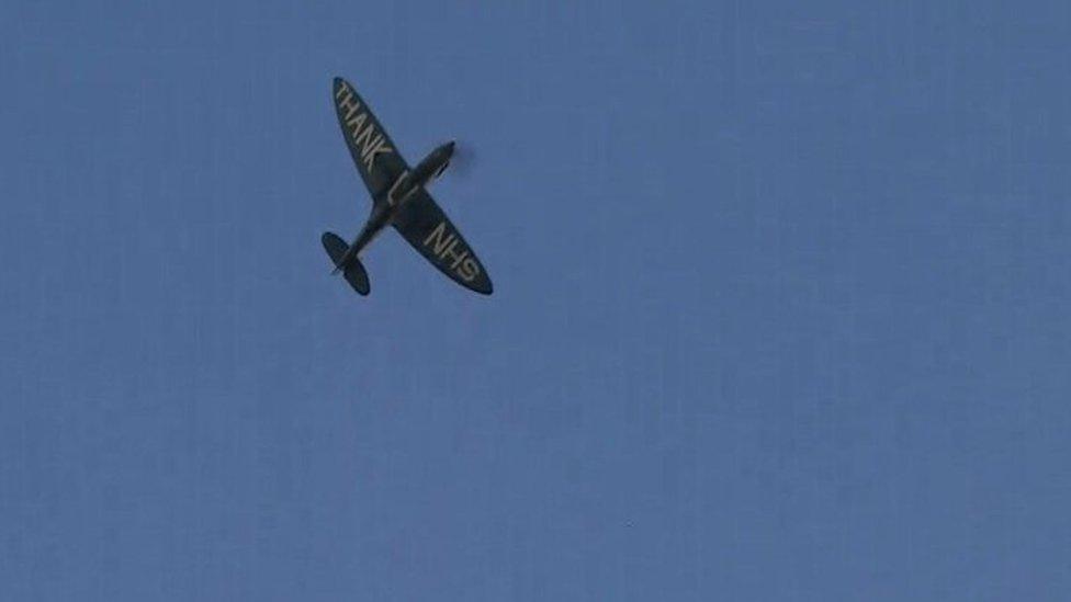 A World War Two Spitfire plane flies over hospitals in Cambridge