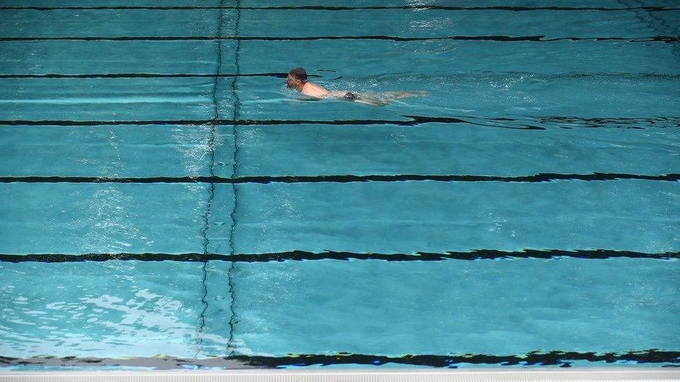 Man swimming in a pool