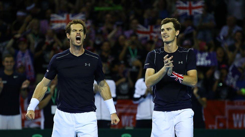 andy murray and jamie murray celebrating a win in the 2016 davis cup