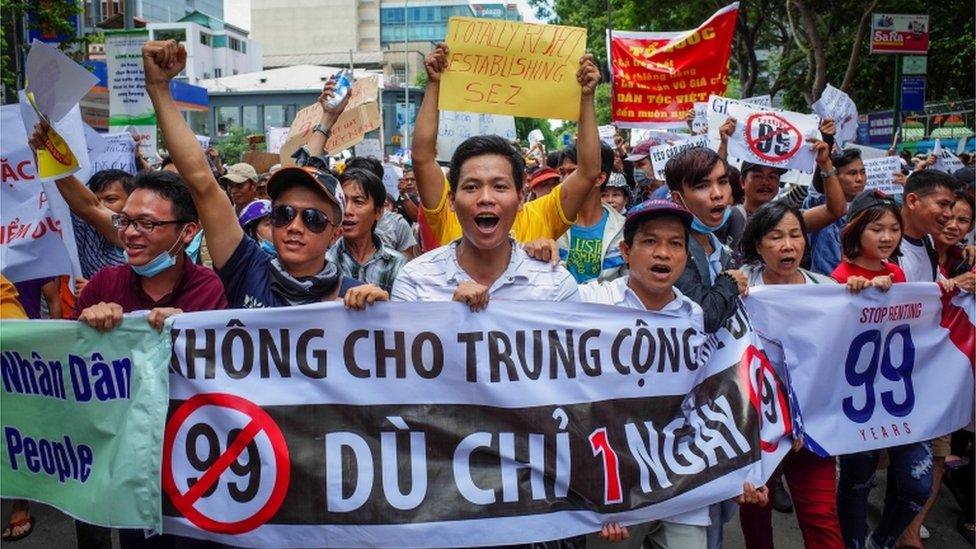 Protesters shout slogans against a proposed plan to grant companies lengthy land leases at a demonstration in Ho Chi Minh City 10 June 2018