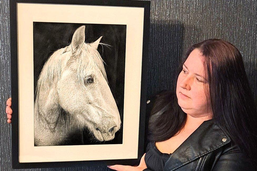 Isabelle Young with portrait of horse