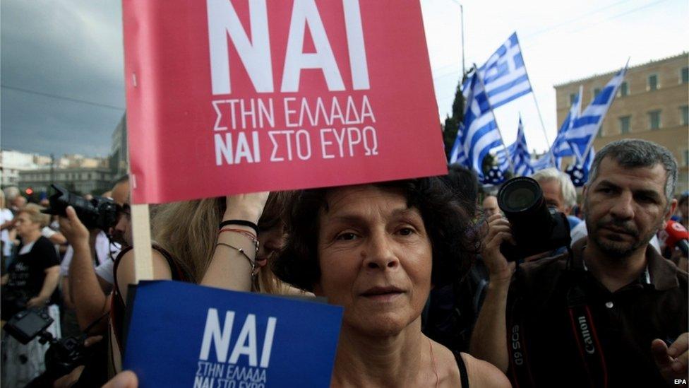 Protesters supporting a "Yes" to the referendum and demanding Greece to remain in the Eurozone rally outside the Greek Parliament in Athens, Greece, 30 June 2015.