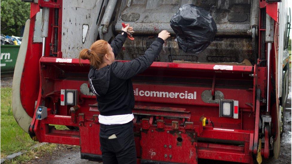 woman dealing with her own rubbish