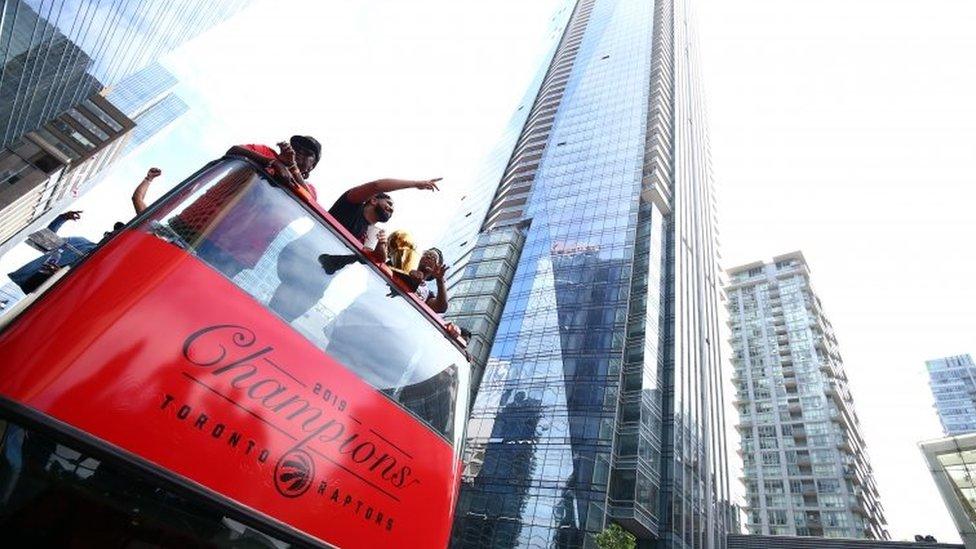 Drake and Kyle Lowry #7 of the Toronto Raptors holds the championship trophy during the Toronto Raptors Victory Parade on June 17, 2019 in Toronto, Canada