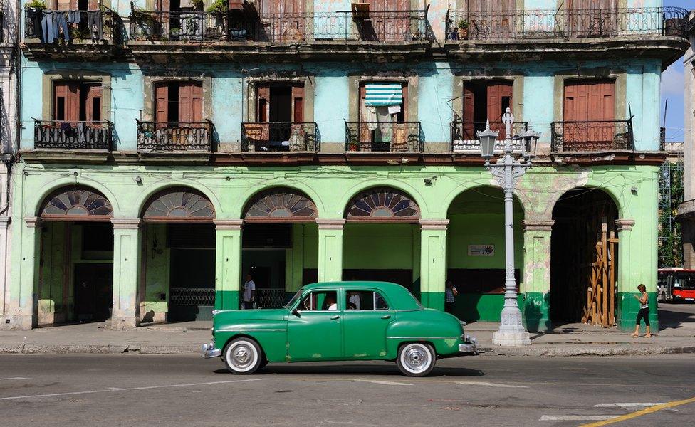 Brightly-painted buildings on Paseo de Marti opposite the National Capitol Building in Havana