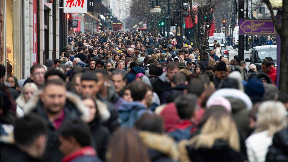 Crowds of shoppers on Oxford Street, London