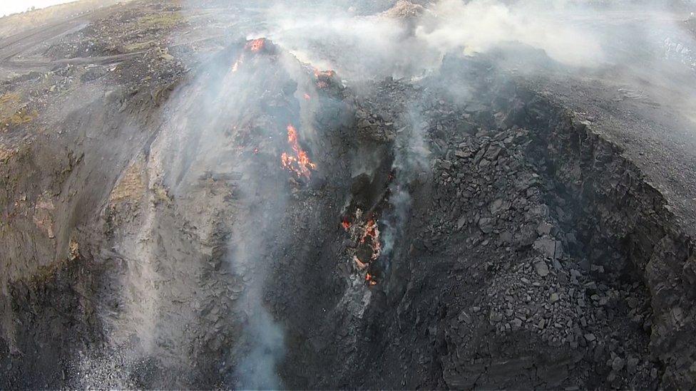 Smouldering coal fires in a mine in India