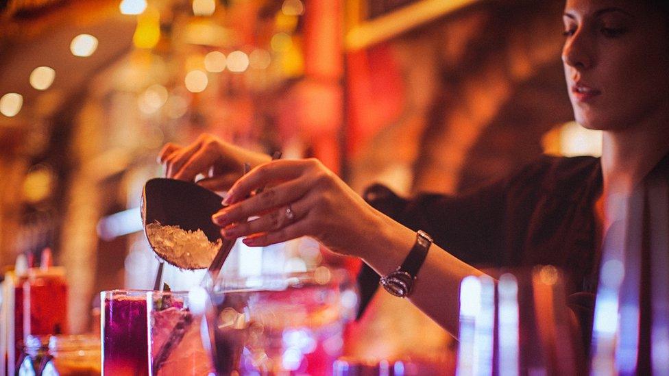 Woman working in a bar