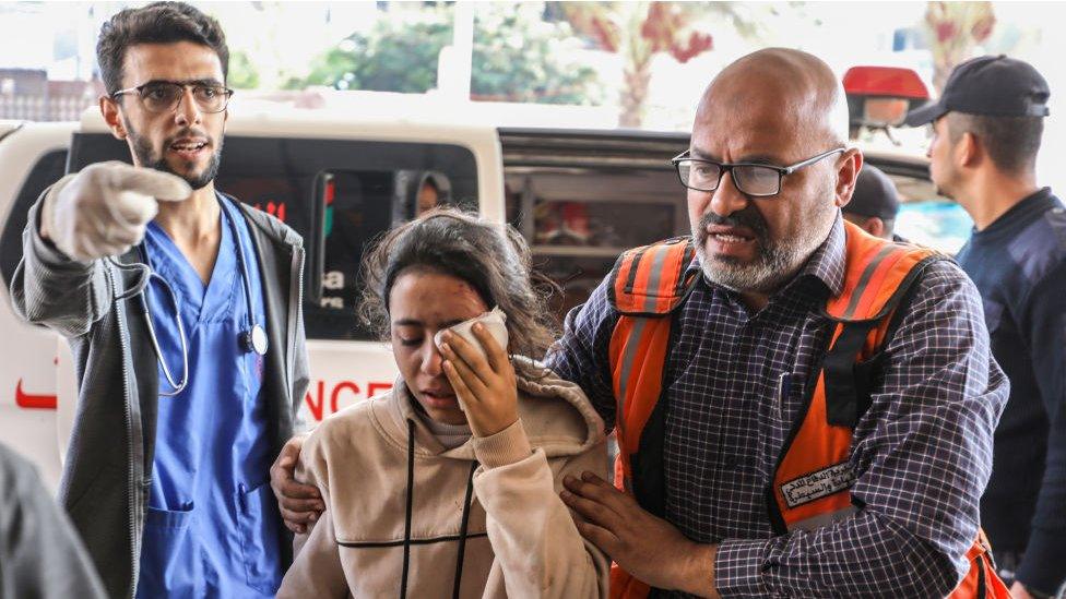 Palestinians injured in Israeli airstrikes arrive at Nasser Medical Hospital in Khan Younis on Saturday