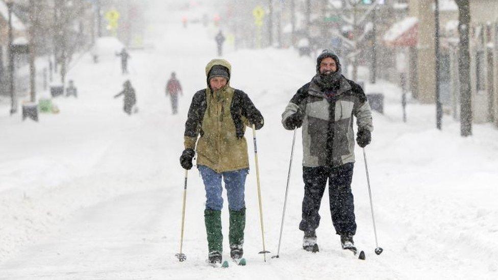 West Virginia University college students ski on High Street in Morgantown (25 January 2016)