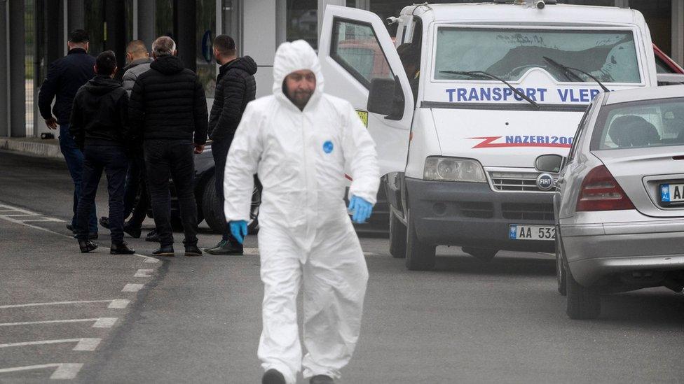 Police at the scene of the airport raid in Tirana