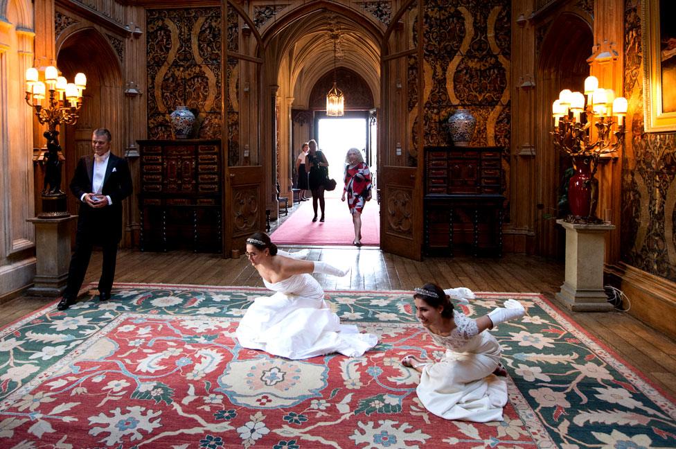 Debutantes rehearse their 'Texas Dip' curtsey prior to the Queen Charlotte's Ball at Highclere Castle on September 13, 2014 near Newbury, England