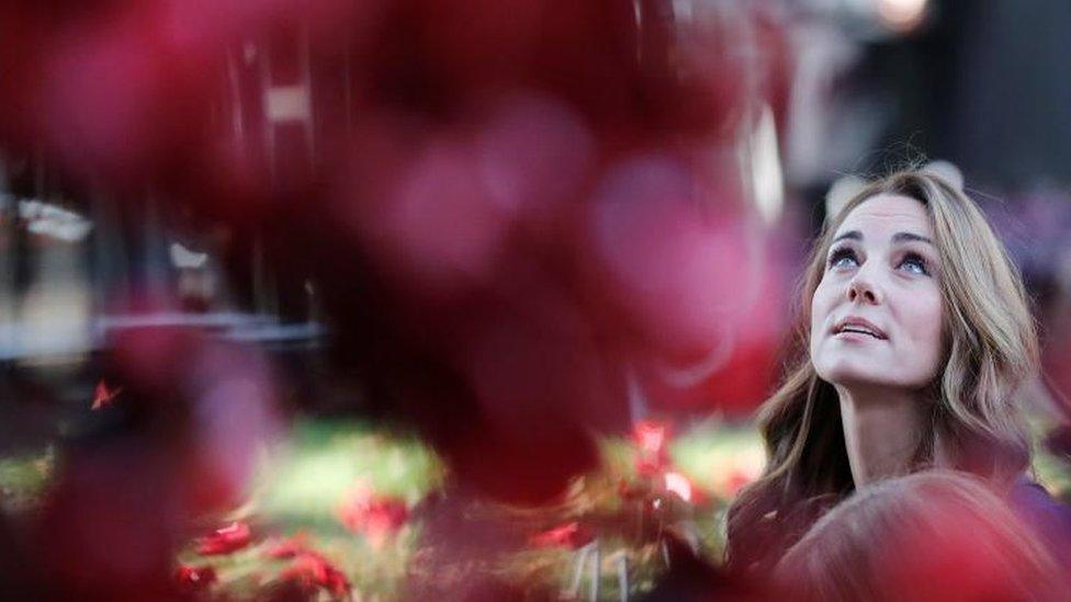 The Duchess of Cambridge, looks at the Weeping Window ceramic poppies installation as she arrives at the Imperial War Museum, in London, on October 31, 2018.