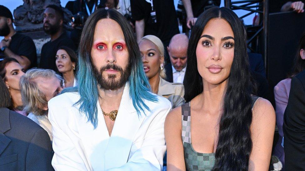 Kim Kardashian alongside performer Jared Leto