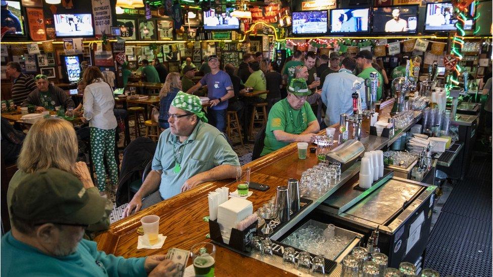 Patrons celebrate St. Patrick's Day at Kilroy's Restaurant & Sports Bar despite the world wide COVID-19 coronavirus pandemic, in Springfield, Virginia, USA, 17 March 2020