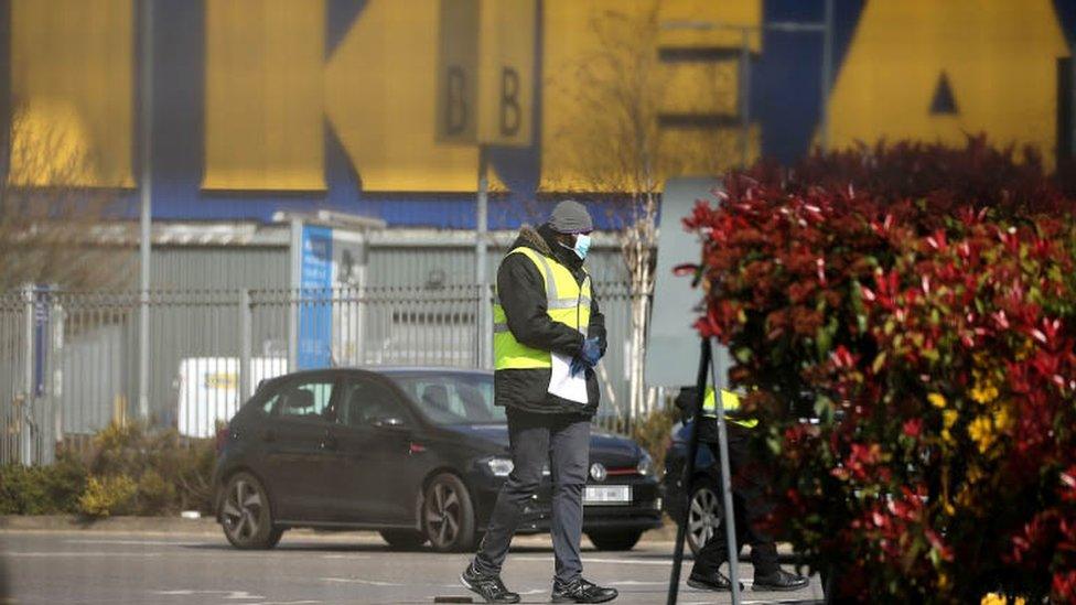 NHS workers wait to be tested for Covid-19 at a drive-in facility set up in IKEA car park in Wembley, north-west London on 31 March, 2020