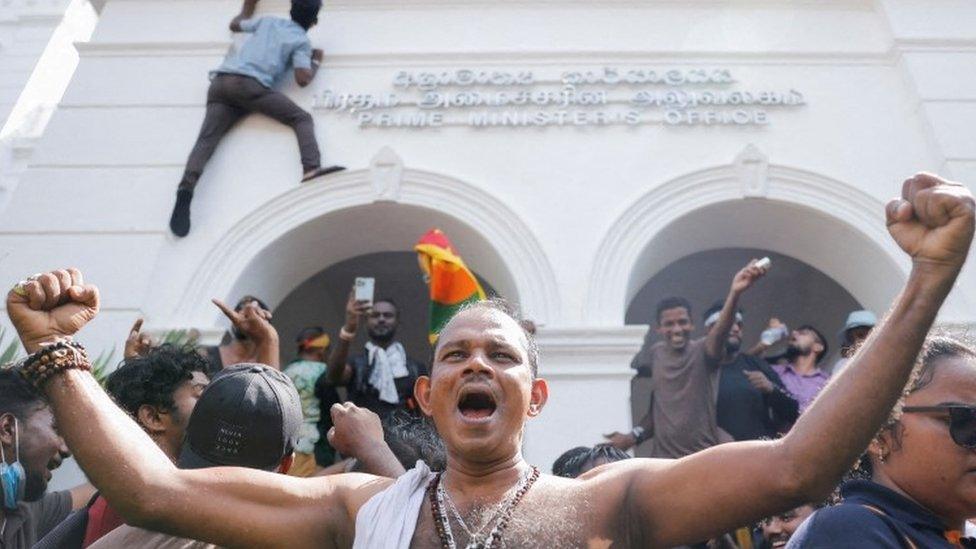 Protesters celebrate after entering PM's office