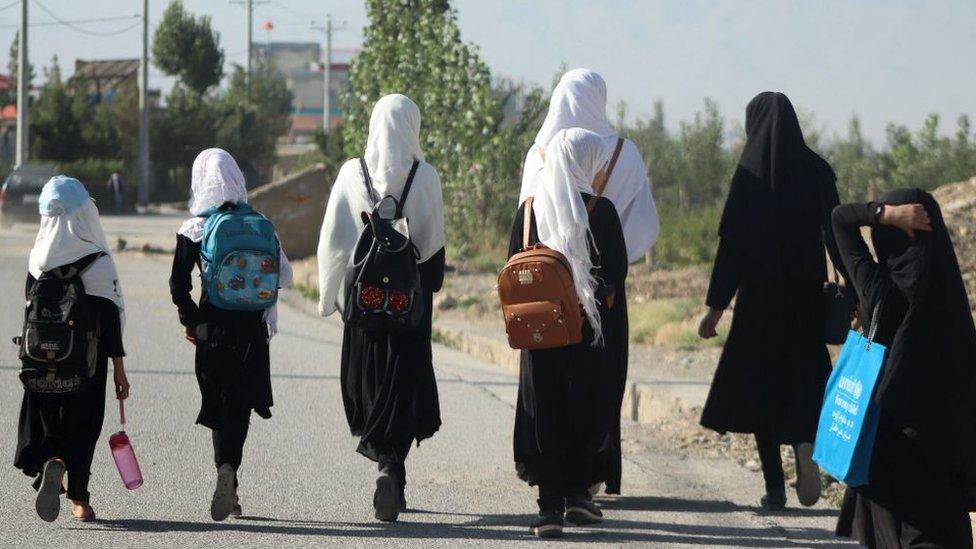 Girls walk to their school along a road in Gardez, Paktia porvince, on September 8, 2022.