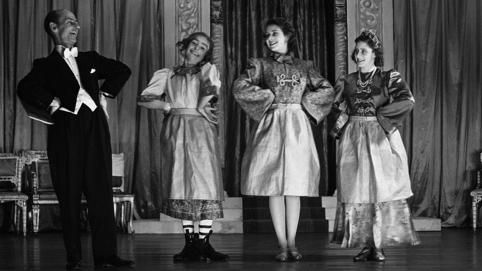 Queen Elizabeth II and Princess Margaret performing