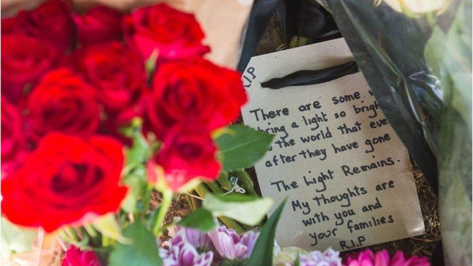 People leave flowers and tributes at the scene of the crash in Penge