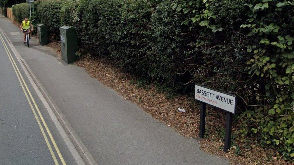 Cyclist on the footpath in Bassett Avenue