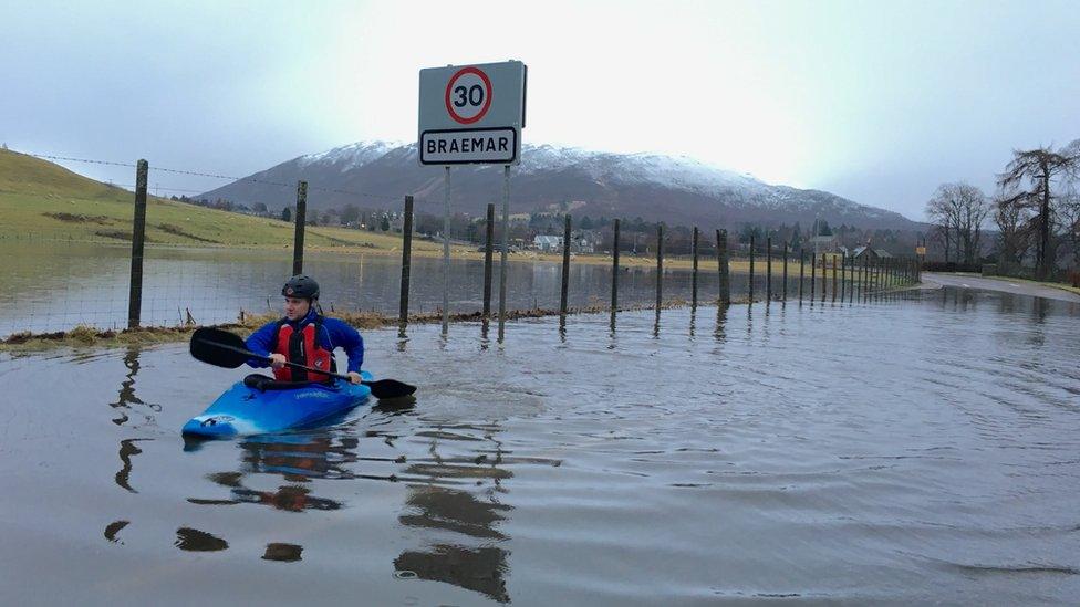 Man kayaking along the A93 at Braemar